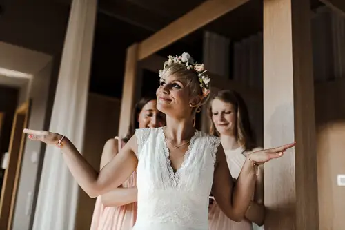 happy and relaxed mood while putting on wedding dress