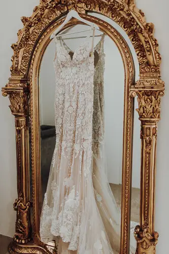a golden mirror is a perfect place for your wedding gown.